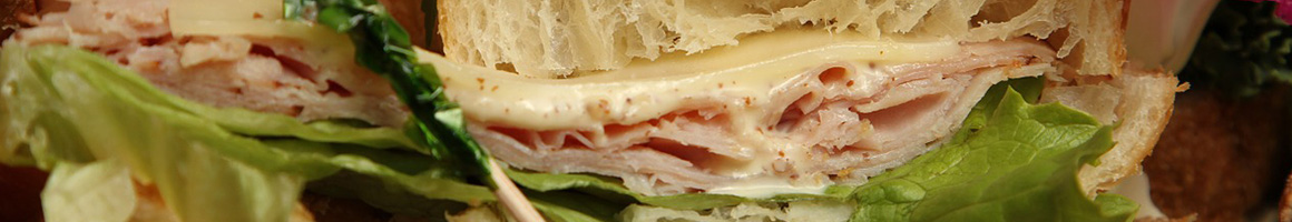 Eating Sandwich at D'Elia's Grinders restaurant in Riverside, CA.